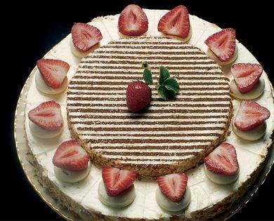 Chocolate sponge cake with vanilla buttercream and strawberry wreath