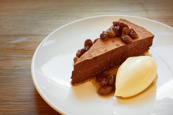 Chocolate torte with rum-soaked raisins and clotted cream