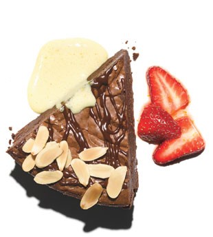 Chocolate truffle pie with orange-Champagne sabayon and strawberries