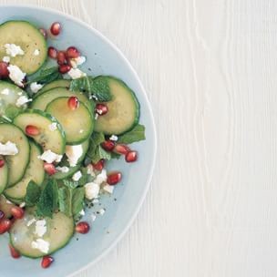 Chopped cucumber salad with pomegranate, feta and mint