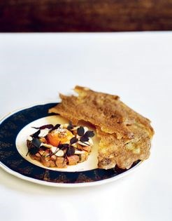 Chopped Dexter beef tartare, Devon smoked eel, egg yolk, almond and sorrel, black pepper cracker
