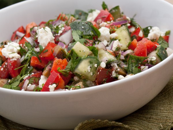 Chopped Greek salad with fresh herbs