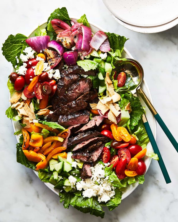 Chopped Greek salad with grilled steak 