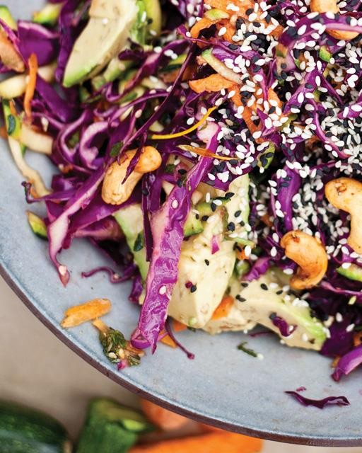 Chopped slaw salad with avocados, cashews, & sesame seeds