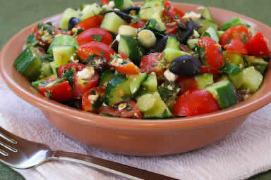 Chopped tomato and cucumber salad with mint, feta, lemon, and thyme