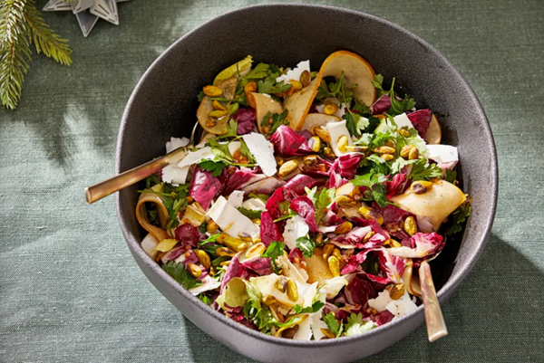 Chopped winter greens salad with pears and date dressing