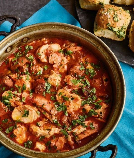 Chorizo fish stew with garlic bread