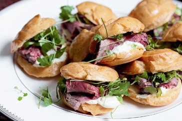 Choux pastries with rare beef and horseradish cream