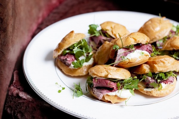 Choux pastries with rare beef and horseradish cream