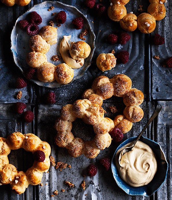 Choux wreaths with burnt-honey cream, raspberries and sesame praline