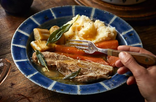 Cider & garlic-braised pork belly with sage butter celeriac mash