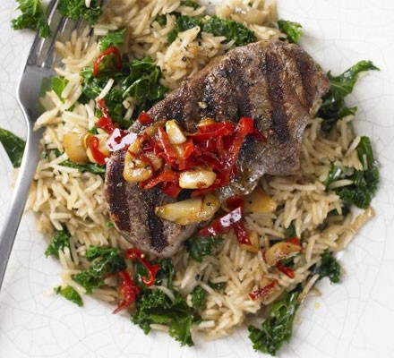 Cinnamon lamb steaks with rice and kale