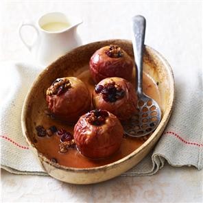 Cinnamon, walnut and berry-stuffed baked apples with maple syrup