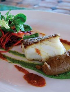 Citrus and herb-roasted cod with chorizo sauce (Bacalao al horno con hierbas y salsa de chorizo)
