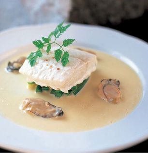 Citrus-baked halibut fillet with oyster and Champagne velouté