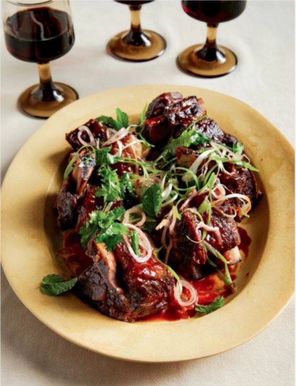 Citrus braised short ribs with herb salad