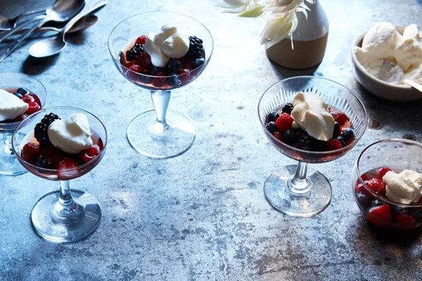 Citrus-macerated berries with fresh whipped cream 