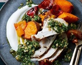 Citrus-rubbed roast chicken with herby walnut salsa & sweet potatoes