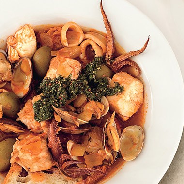Clam and calamari seafood stew with salsa verde