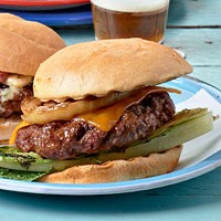 Classic cheeseburgers with grilled romaine and onions