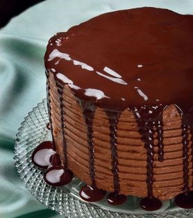 Classic layer cake with chocolate buttercream icing and chocolate glaze