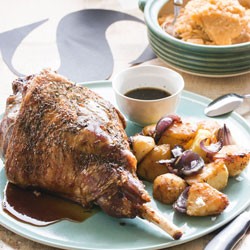 Classic roast lamb with roast potatoes, mashed swede and mint sauce