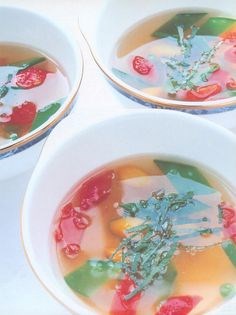 Clear chilled tomato juice with basil and summer vegetables