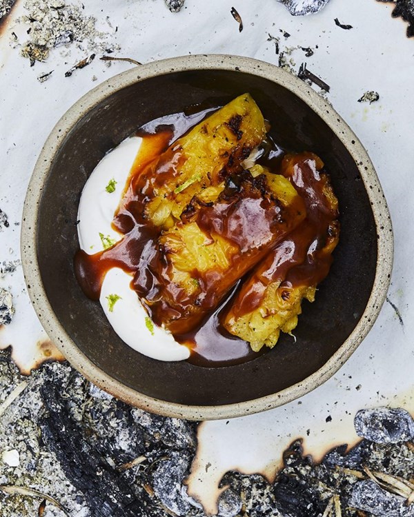 Coal-roasted pineapple with spiced rum burnt caramel & lime cream