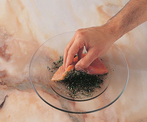 Coating fish with a herb crust