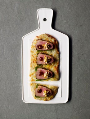 Cocas with marinated duck, Cabrales béchamel, and cherry-fig marmalade