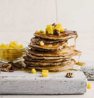 Coconut and cardamom pancakes with mango