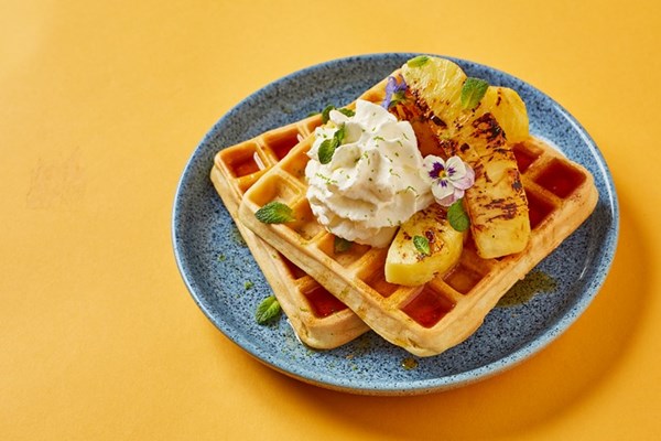 Coconut and lime waffles with caramelised pineapple