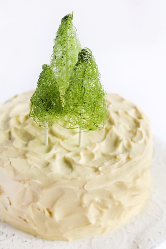Coconut cake with spun sugar Christmas trees