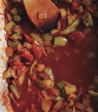 Coconut-crusted mahimahi with pan-roasted garlic, rosemary, and tomato sauce