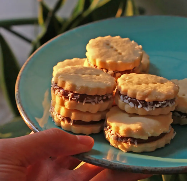 Coconut jam shortbread sandwich cookies (Matamis na bao alfajores)