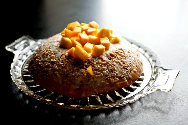 Coconut macaroon and mango bombe