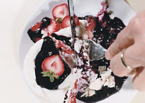 Coconut macaroons with strawberries and huckleberry sauce