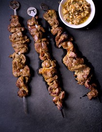 Coconut-marinated short rib kebabs with peanut-chile oil