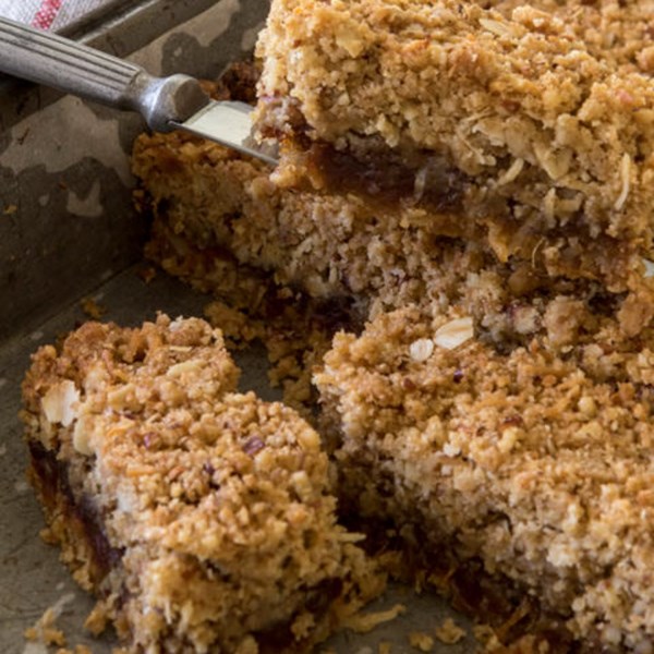 Coconut, oat and pecan bars with sticky date filling