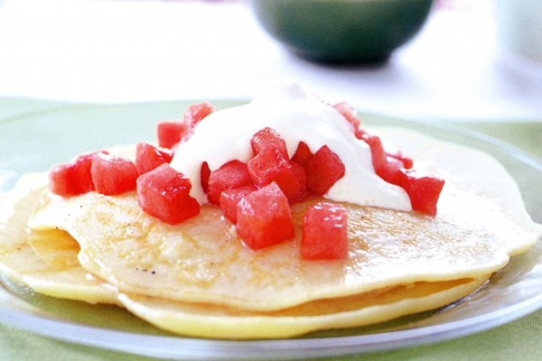 Coconut pancakes with watermelon in vanilla syrup