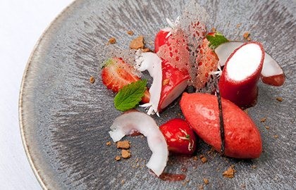 Coconut panna cotta with strawberry gel, strawberry sorbet and cut Sweet Eve strawberries
