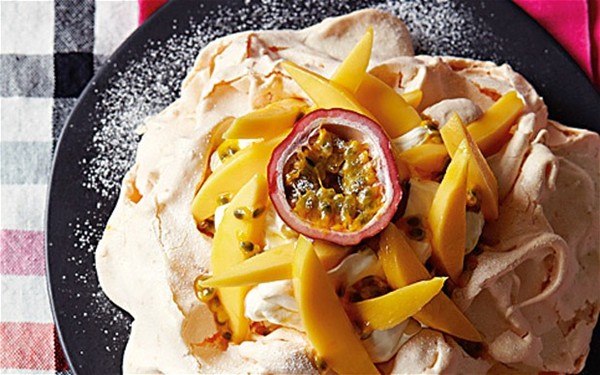 Coconut pavlova with mango and passion fruit and ginger cream