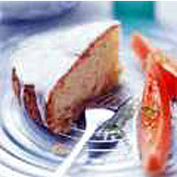 Coconut pound cake served with papaya