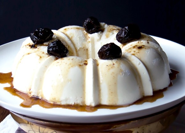 Coconut pudding with prune sauce