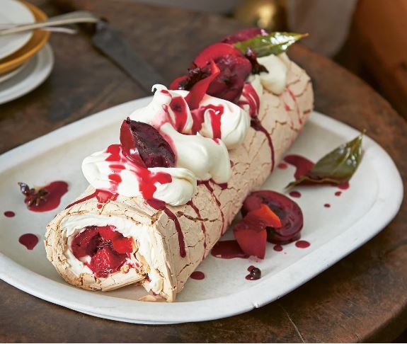 Coconut sugar Pavlova roll with spiced grilled blood plums