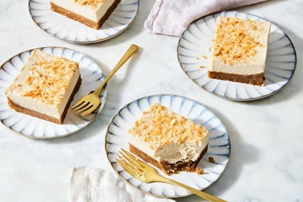 Coconut vegan cheesecake bars with nut crust