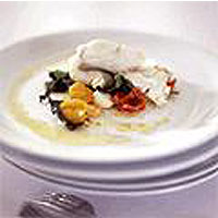 Cod in a bag with cherry tomatoes, olives and basil 
