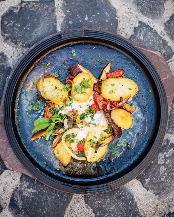 Cod on a stone with potatoes, mushrooms and cherry tomatoes (Merluzzo cotto su pietra con patate, porcini e pomodori)