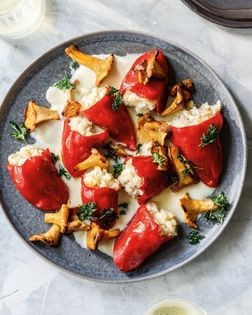 Cod-stuffed piquillo peppers with garlic cream and chanterelles