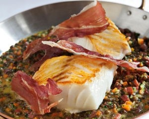 Cod with braised lentils and prosciutto